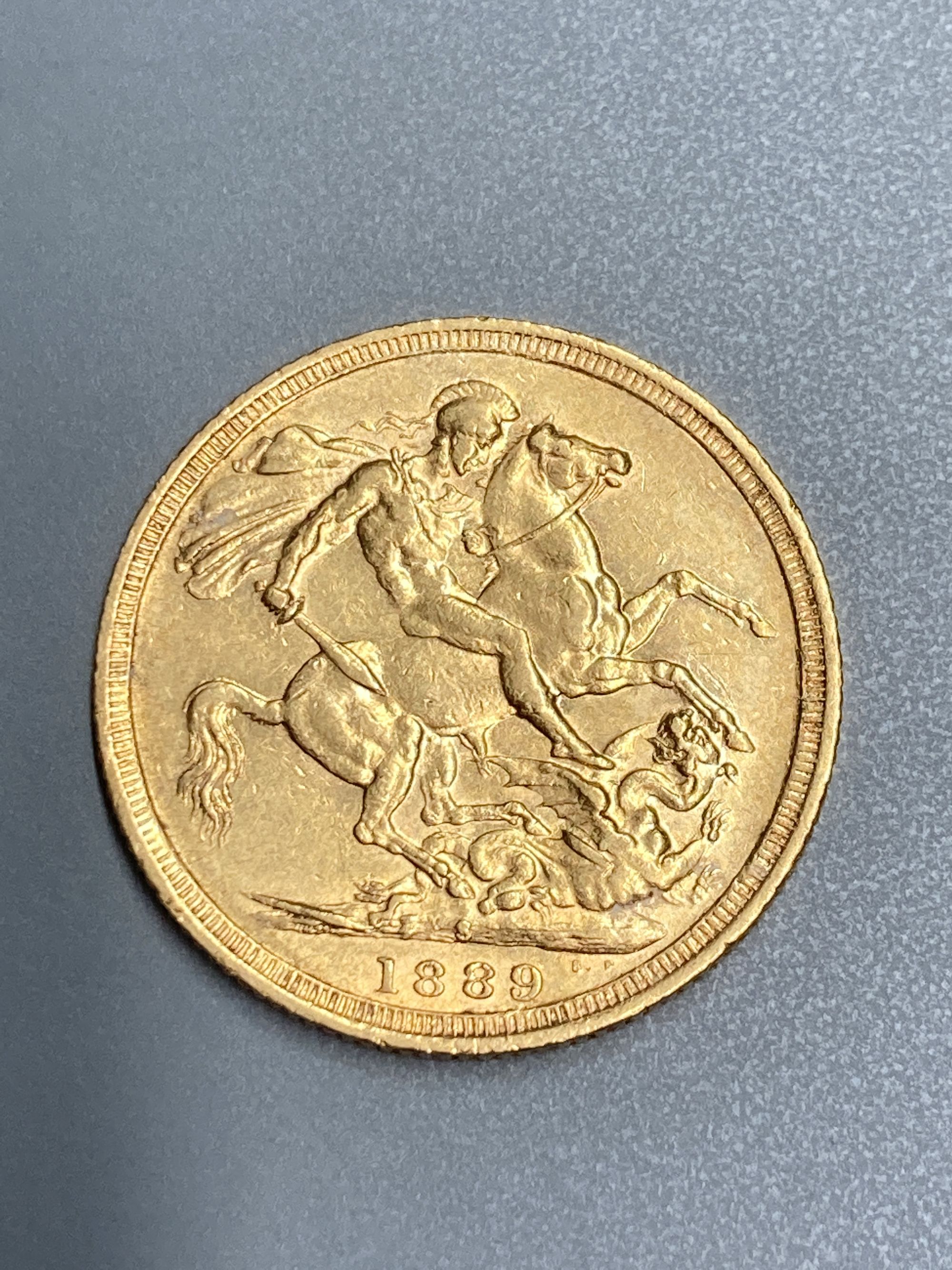 A Victoria 1889 gold sovereign, F or better.